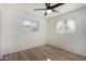 Bright bedroom featuring wood-look floors and ceiling fan at 1011 E 6Th Ave, Mesa, AZ 85204