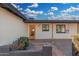 Inviting front entrance with a bright orange door and brick walkway at 1011 E 6Th Ave, Mesa, AZ 85204