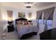 Bright bedroom with a king-size bed and ample window light at 11500 E Cochise Dr # 2070, Scottsdale, AZ 85259