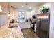 Spacious kitchen with granite countertops and stainless steel appliances at 11500 E Cochise Dr # 2070, Scottsdale, AZ 85259
