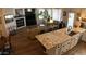 Open kitchen with granite countertops and island, flows into living area at 11500 E Cochise Dr # 2070, Scottsdale, AZ 85259