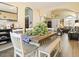 Inviting dining area that connects to the living room and features a stylish wood table and ample natural light at 126 E Key West Dr, Casa Grande, AZ 85122