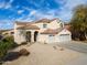 Two-story home featuring a two-car garage and low maintenance desert landscaping at 126 E Key West Dr, Casa Grande, AZ 85122
