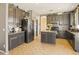 Modern kitchen with stainless steel appliances and a kitchen island at 126 E Key West Dr, Casa Grande, AZ 85122