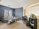 Cozy living room featuring a plush sofa, modern coffee table, and neutral carpeting at 126 E Key West Dr, Casa Grande, AZ 85122