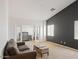 Bright living room with neutral walls, comfortable seating, and natural light, creating an open and airy atmosphere at 126 E Key West Dr, Casa Grande, AZ 85122
