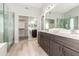 Double vanity bathroom with a large walk-in shower and separate tub at 12815 E Becker Ln, Scottsdale, AZ 85259