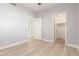 Bedroom with wood-look floors and access to closet at 12815 E Becker Ln, Scottsdale, AZ 85259