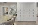 Elegant dining area with marble table and built-in cabinetry at 14301 W Circle Ridge Dr, Sun City West, AZ 85375