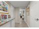 Bright hallway with built-in cabinets and artwork at 14301 W Circle Ridge Dr, Sun City West, AZ 85375