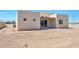 New construction home with unfinished backyard and sliding glass door at 14825 S Charco Rd, Arizona City, AZ 85123