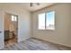 Bedroom with ensuite bathroom and wood-look floors at 14825 S Charco Rd, Arizona City, AZ 85123