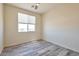 Bright bedroom with wood-look floors and window coverings at 14825 S Charco Rd, Arizona City, AZ 85123