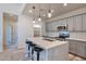 Modern kitchen with gray cabinets and a large island at 14825 S Charco Rd, Arizona City, AZ 85123