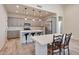 Modern kitchen with gray cabinets, quartz countertops, and island at 14825 S Charco Rd, Arizona City, AZ 85123