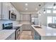 Modern kitchen with gray cabinets and stainless steel appliances at 14825 S Charco Rd, Arizona City, AZ 85123