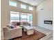 Spacious living room with L-shaped sofa, fireplace and large windows at 14825 S Charco Rd, Arizona City, AZ 85123