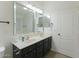 Bathroom with double vanity and large mirror at 15877 W Diamond St, Goodyear, AZ 85338