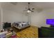 Bedroom with wood flooring and a ceiling fan at 15877 W Diamond St, Goodyear, AZ 85338