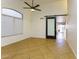 Bright dining room with tile floors and barn door at 15877 W Diamond St, Goodyear, AZ 85338