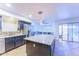 Kitchen features granite countertops, island, and stainless steel appliances at 15877 W Diamond St, Goodyear, AZ 85338