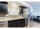 Kitchen features stainless steel appliances and granite countertops at 15877 W Diamond St, Goodyear, AZ 85338