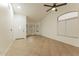 Spacious living room with tile floors and multiple windows at 15877 W Diamond St, Goodyear, AZ 85338