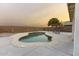 Inviting kidney-shaped pool with pergola and chairs at 15877 W Diamond St, Goodyear, AZ 85338