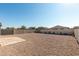 Spacious backyard with gravel and a small patio area at 1673 E Jardin Pl, Casa Grande, AZ 85122