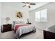 Spacious bedroom with ceiling fan and large window at 1673 E Jardin Pl, Casa Grande, AZ 85122