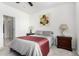 Bright bedroom with double bed and en-suite bathroom access at 1673 E Jardin Pl, Casa Grande, AZ 85122