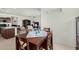 Dining area with wood table and chairs, adjacent to the kitchen at 1673 E Jardin Pl, Casa Grande, AZ 85122