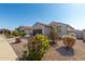 Single-story home with two-car garage and desert landscaping at 1673 E Jardin Pl, Casa Grande, AZ 85122