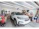 Two-car garage with a car and storage items at 1673 E Jardin Pl, Casa Grande, AZ 85122