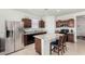 Modern kitchen featuring granite countertops and stainless steel appliances at 1673 E Jardin Pl, Casa Grande, AZ 85122