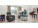 Relaxing living room with two recliners and sliding door access to backyard at 1673 E Jardin Pl, Casa Grande, AZ 85122