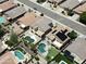 Aerial view of homes with swimming pools and solar panels in a suburban neighborhood at 1801 W Nighthawk Way, Phoenix, AZ 85045