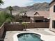 Backyard with brick privacy fence, desert landscaping, and partial views of mountain at 1801 W Nighthawk Way, Phoenix, AZ 85045