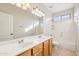 Well-lit bathroom features double sinks and a bathtub with shower, ideal for a functional design at 1801 W Nighthawk Way, Phoenix, AZ 85045