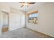 Inviting bedroom with a ceiling fan, closet, and window views, offering a comfortable living space at 1801 W Nighthawk Way, Phoenix, AZ 85045