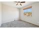 Bright bedroom with carpeted floors and a window showcasing outdoor views, creating a cozy space at 1801 W Nighthawk Way, Phoenix, AZ 85045