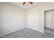 Bedroom featuring neutral walls, closet, and window view, creating a comfortable and inviting space at 1801 W Nighthawk Way, Phoenix, AZ 85045