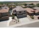 Two-story home with desert landscaping, a spacious driveway, a two-car garage, and a backyard pool viewed from above at 1801 W Nighthawk Way, Phoenix, AZ 85045