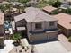 Two-story home with desert landscaping, a spacious driveway, a two-car garage, and a backyard pool viewed from above at 1801 W Nighthawk Way, Phoenix, AZ 85045