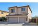 Picture of a two-story home featuring a three-car garage and desert landscaping, with a view of mountains at 1801 W Nighthawk Way, Phoenix, AZ 85045