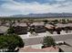 Two-story home with desert landscaping, spacious driveway, and a two-car garage in a community with mountain views at 1801 W Nighthawk Way, Phoenix, AZ 85045