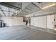 Spacious garage featuring epoxy floors, ample storage cabinets, and overhead racks at 1801 W Nighthawk Way, Phoenix, AZ 85045