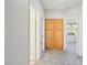 Hallway view featuring wood closet and natural light from the bedroom, offering a welcoming transition at 1801 W Nighthawk Way, Phoenix, AZ 85045