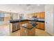 This eat-in kitchen features a central island with wood cabinetry and granite countertops, plus stainless steel appliances at 1801 W Nighthawk Way, Phoenix, AZ 85045