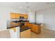 Bright eat-in kitchen showcases wood cabinets, granite countertops, a kitchen island and stainless steel appliances at 1801 W Nighthawk Way, Phoenix, AZ 85045